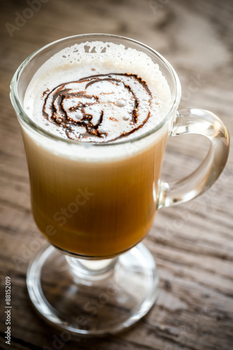 Glass mug with cappuccino