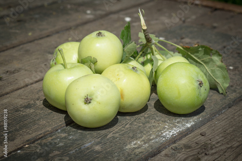 Papirovka grade apples, white apple on old wooden table top photo