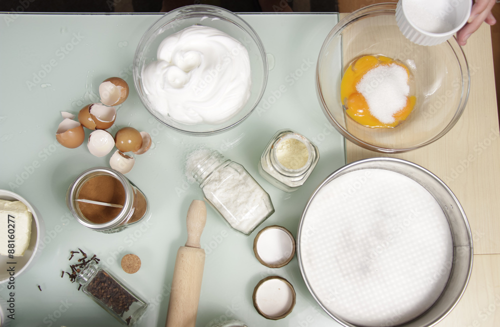 Kitchen table full of ingredients, for cake. Kitchen table full of ingredients, for cake.
