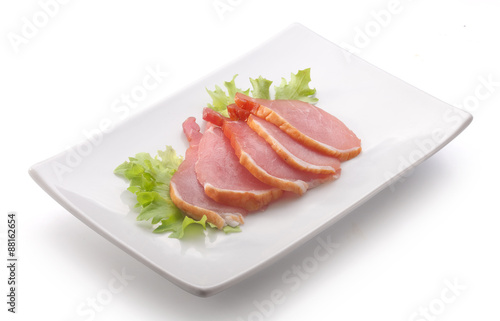 Slices of pork balyk on the plate
