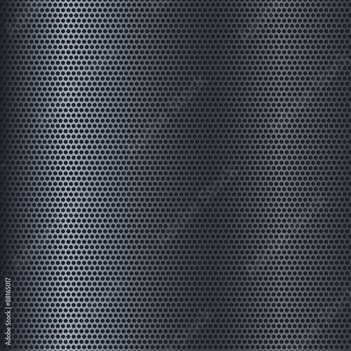 Metal texture with perforation. Dark steel background.