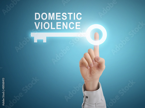 male hand pressing domestic violence key button