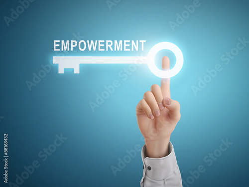 male hand pressing empowerment key button
