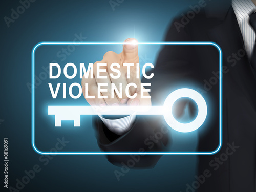 male hand pressing domestic violence key button