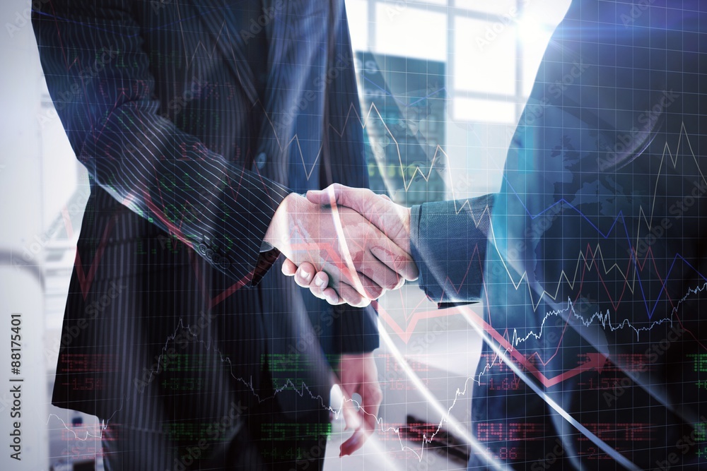 Composite image of business people shaking hands Composite image of business people shaking hands
