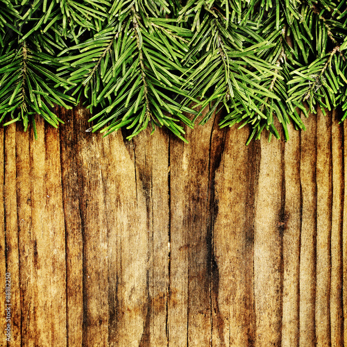 Christmas Background Border. Green Xmas Fir Branch on Wooden Bac