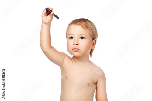 young boy isolated on white painting in the air photo