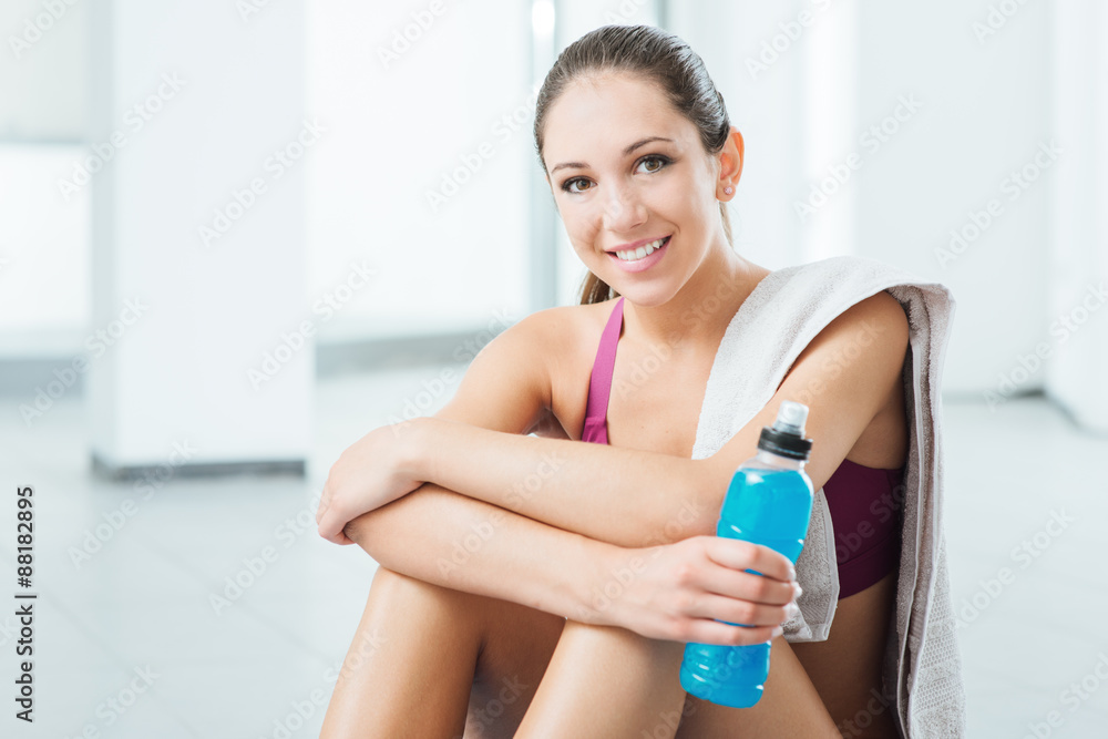 Smiling woman relaxing after workout Smiling woman relaxing after workout