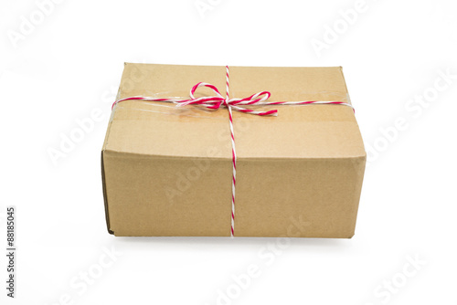 Parcel cardboard box and tied with string