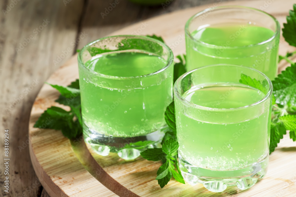 Citrus juice with soda in a glass on a wooden background, select Citrus juice with soda in a glass on a wooden background, select
