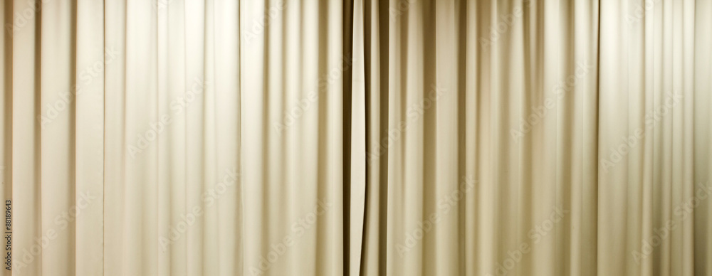 closed curtain with light spots in a theater closed curtain with light spots in a theater