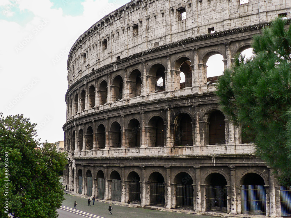 Building Coliseum (Colosseum) in Rome (Italy) and trees in autumn