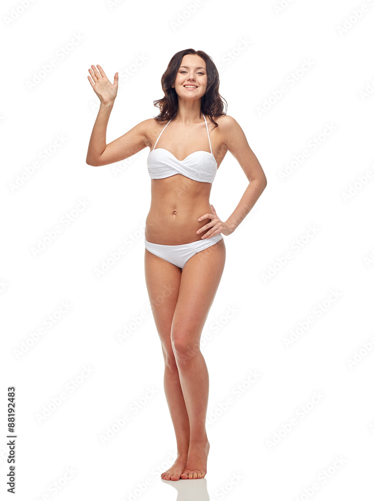 happy young woman in white swimsuit waving hand happy young woman in white swimsuit waving hand