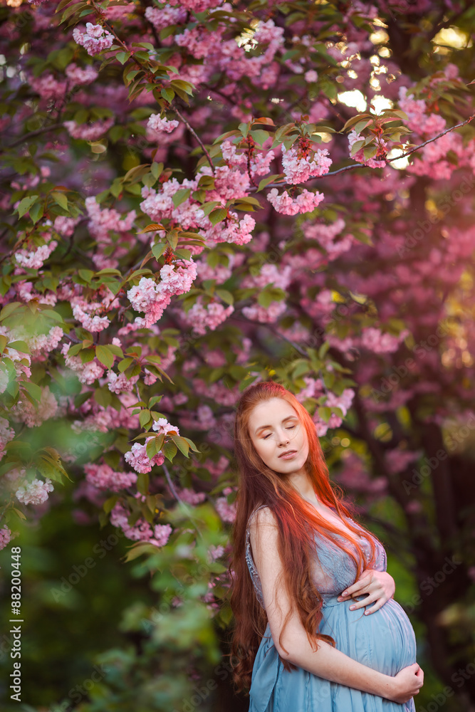 Pregnant caucasian woman takes rest outdoor Pregnant caucasian woman takes rest outdoor