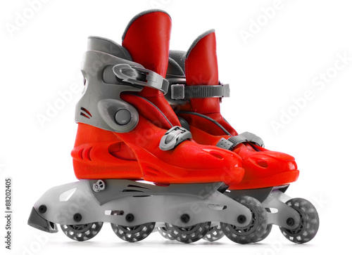 Fotografie A pair of red inline skates isolated on white background