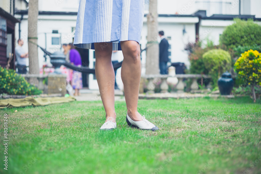Fototapeta premium Woman standing in garden