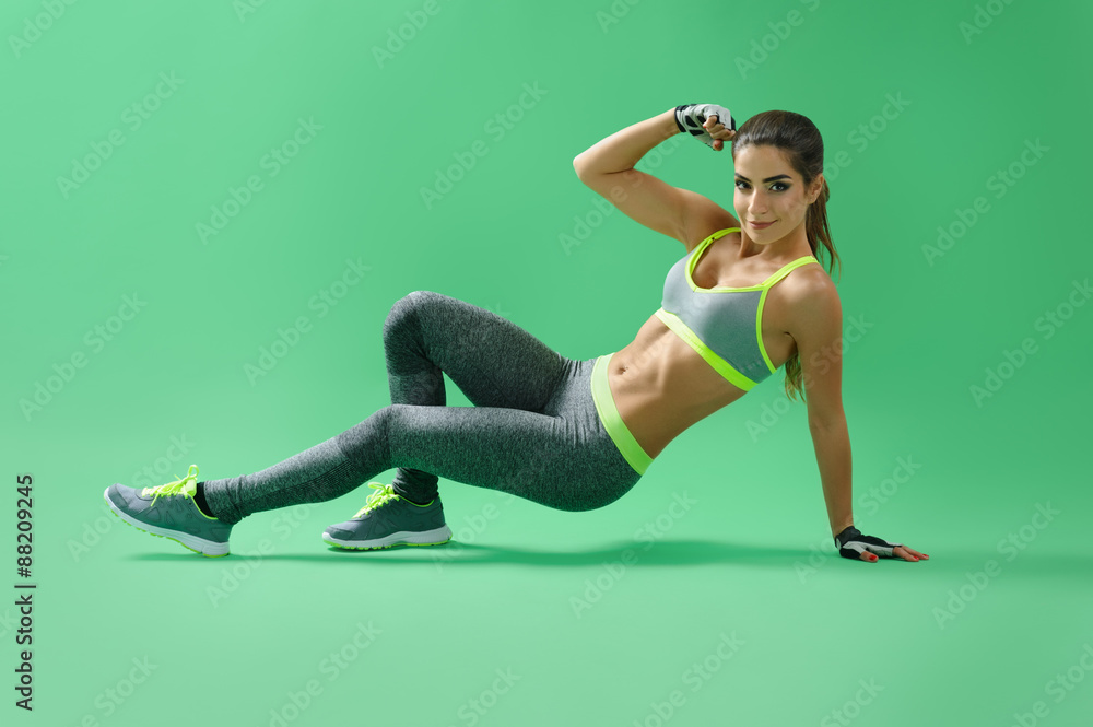 sportswoman performs the a partial squat with an emphasis on lef sportswoman performs the a partial squat with an emphasis on lef