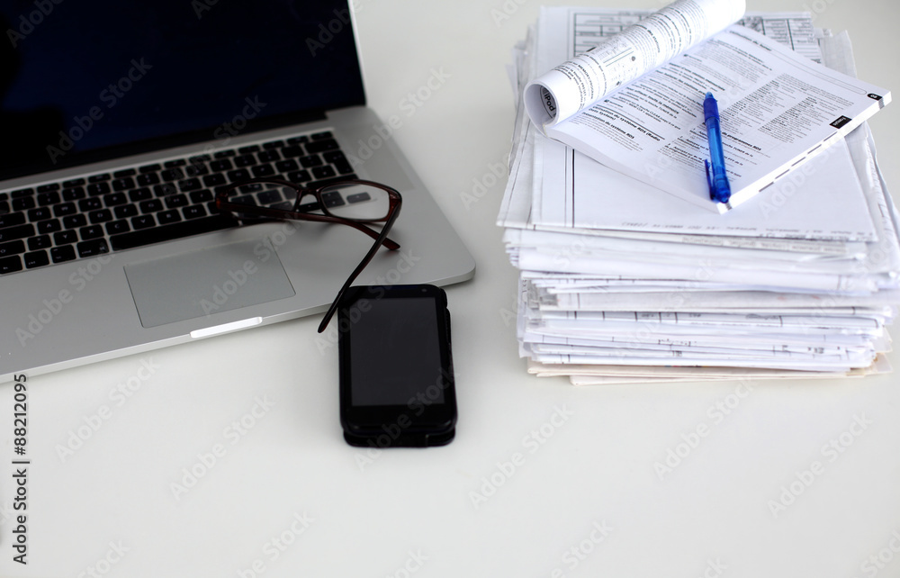 office desk a stack of computer paper reports work forms office desk a stack of computer paper reports work forms