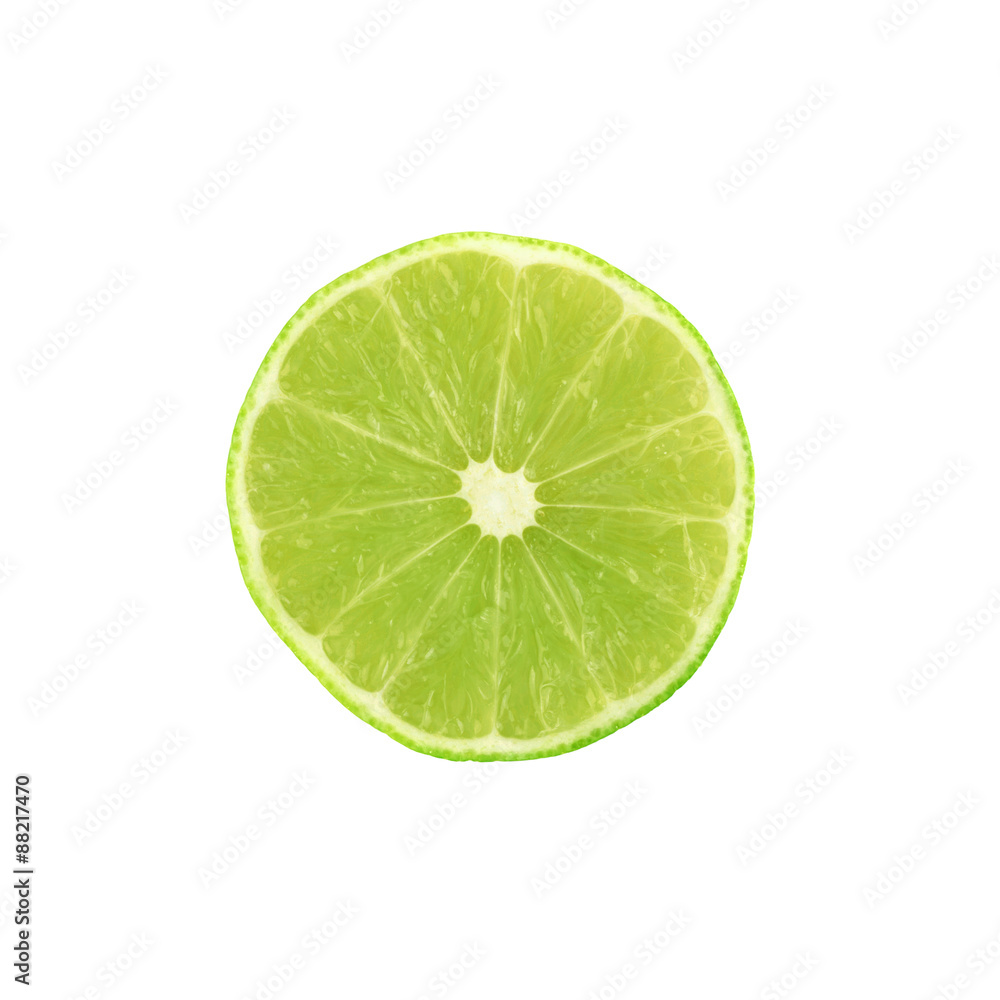 Ripe lime cut in half isolated over the white background Ripe lime cut in half isolated over the white background