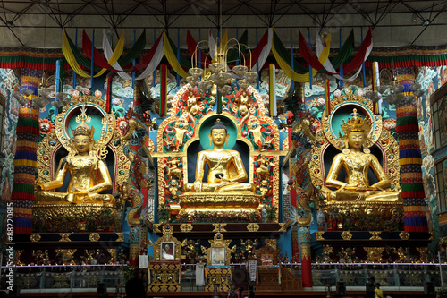 Golden statues of Gautama Buddha, Padmasambhava and Amitayus.