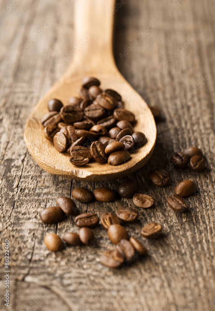 ground coffee in scoop and coffee beans on a wooden background, ground coffee in scoop and coffee beans on a wooden background,