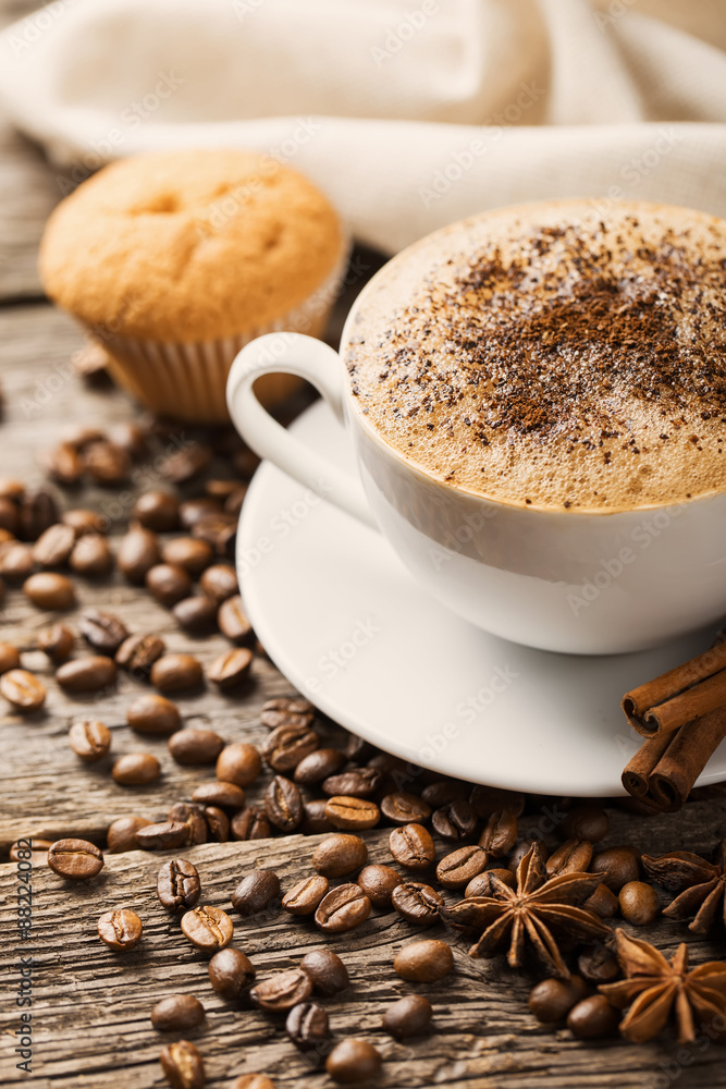 Hot coffee and pastries on a wooden background Hot coffee and pastries on a wooden background