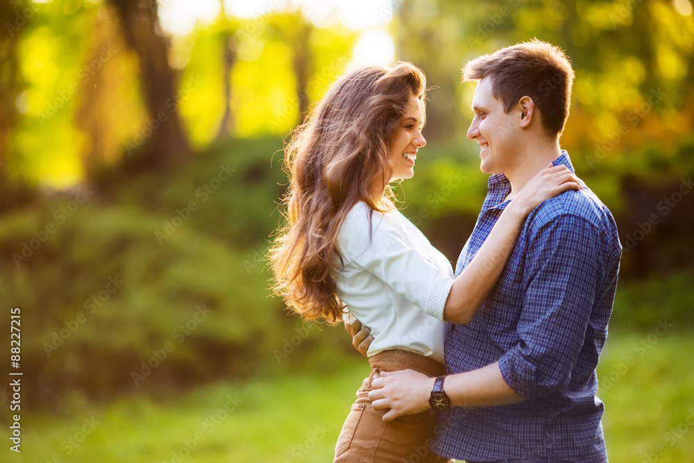 Fototapeta premium loving couple are hugging in park
