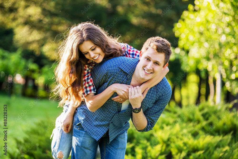 Lifestyle, happy couple of two play on a sunny day in the park Lifestyle, happy couple of two play on a sunny day in the park