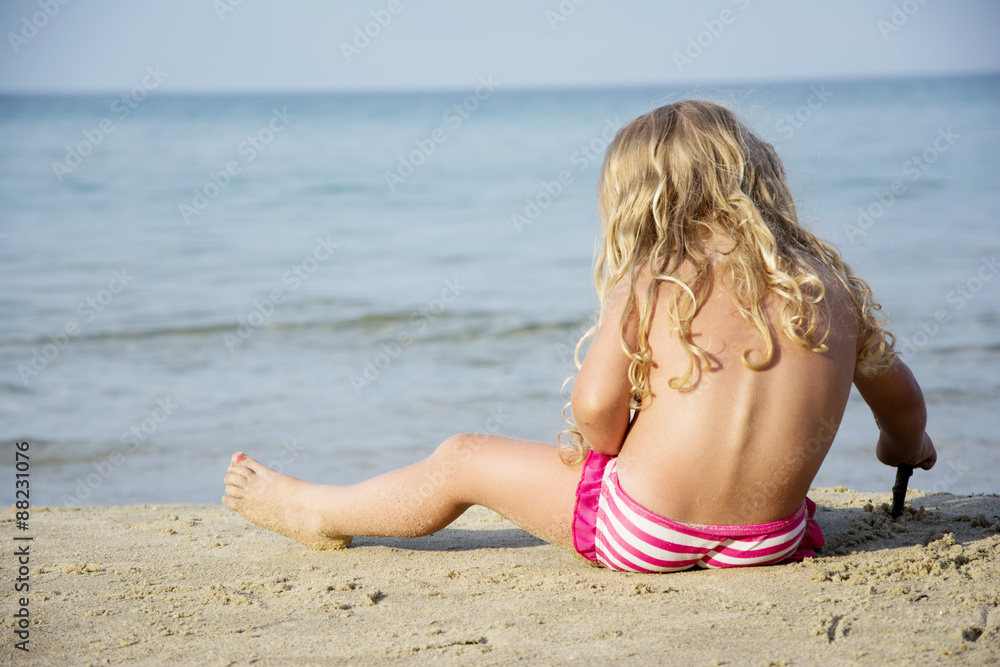 Child playing on beach