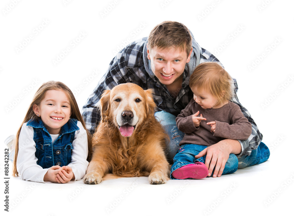 Dad and two daughters  with a dog  