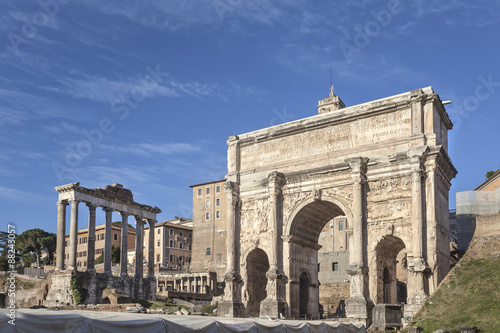 Triumphal Arch of the Emperor Septimius Severus and Saturn temple on Roman forum in Rome, Italy