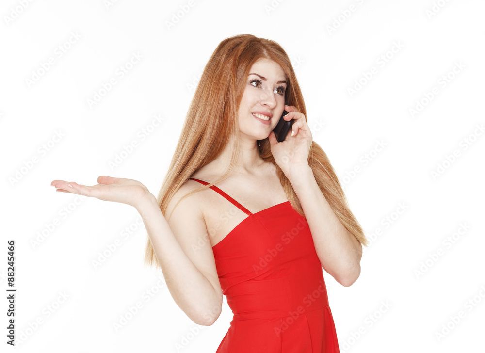 Young beautiful woman talking on the phone and holding something Young beautiful woman talking on the phone and holding something