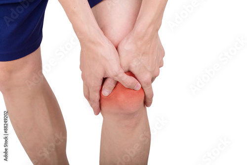 Close up male knee pain isolated white background. © jayzynism