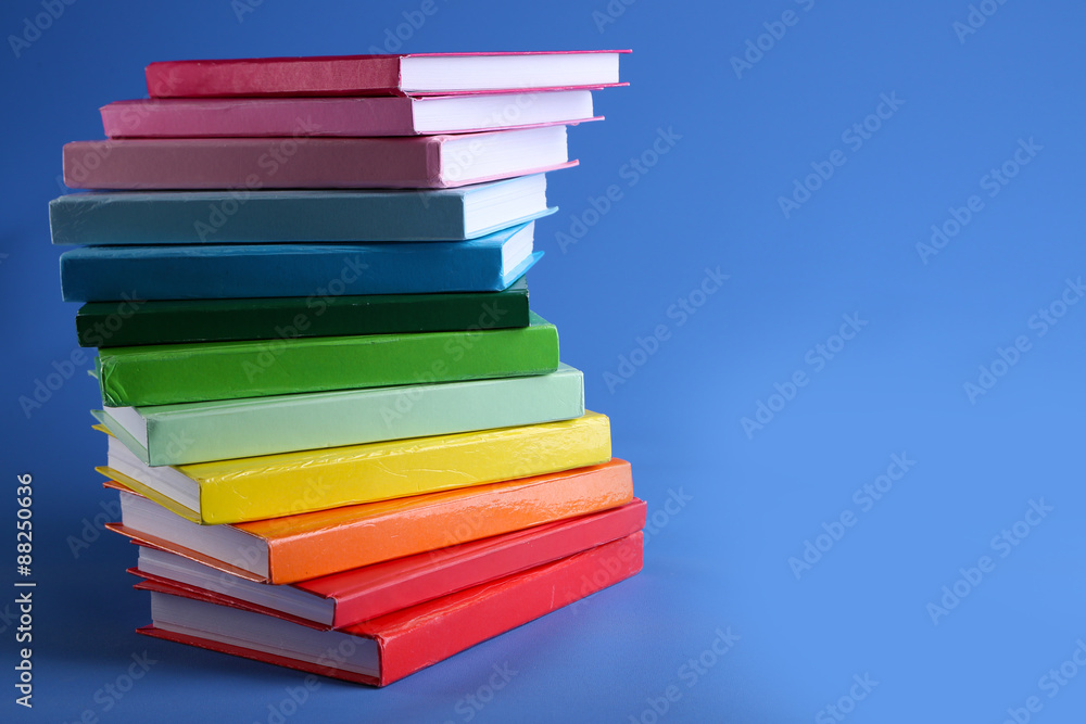 Colorful books on blue background Colorful books on blue background