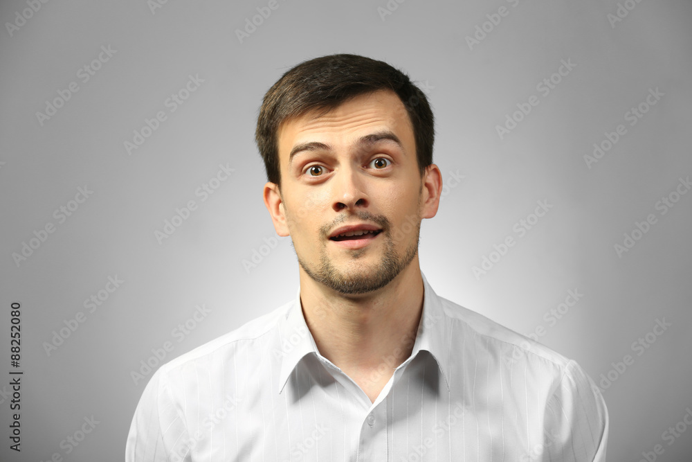 Handsome young man on gray background Handsome young man on gray background