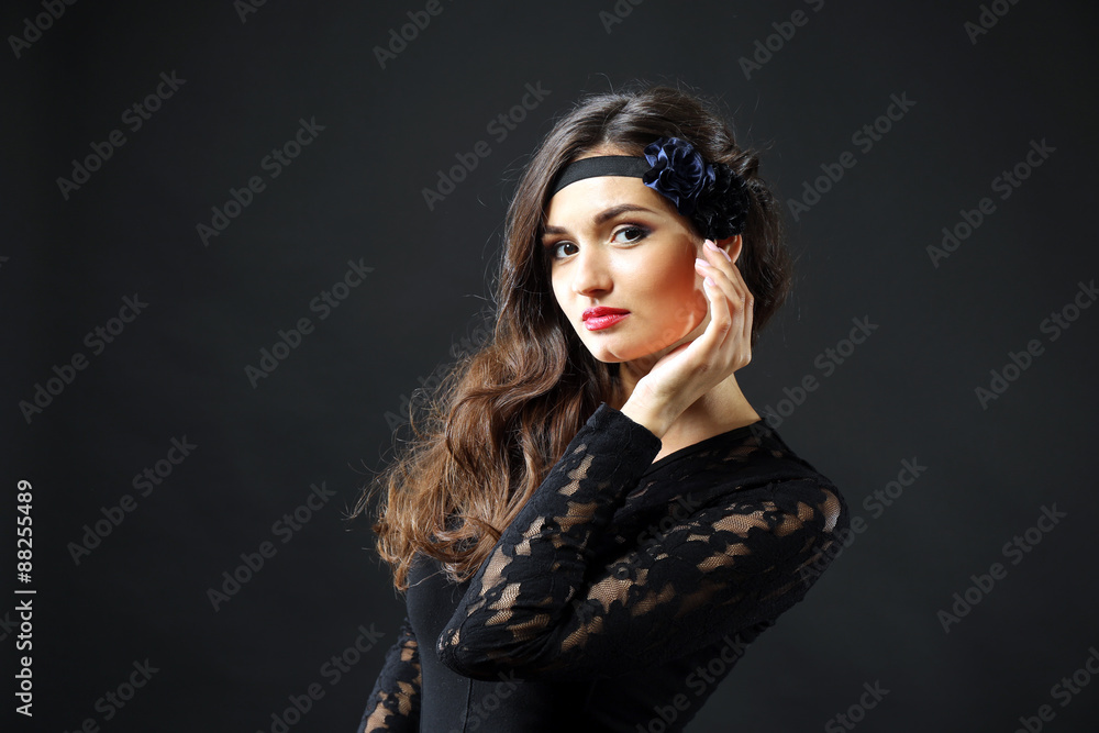Retro style portrait of young woman on dark background Retro style portrait of young woman on dark background