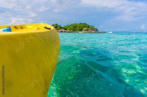 Paddling yellow kayak into the Andaman sea