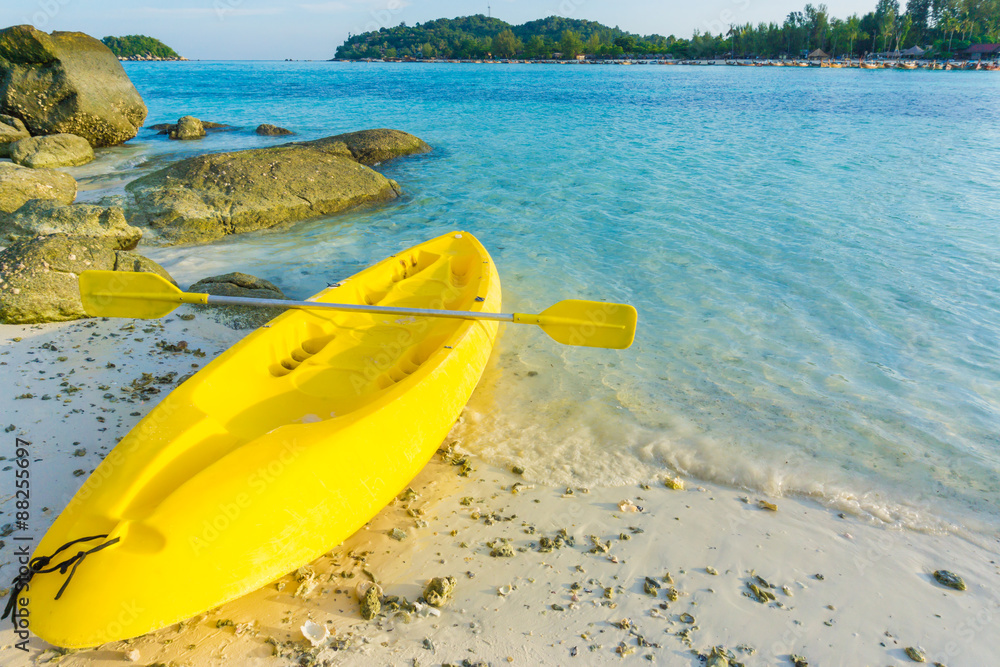 Colorful yellow kayaks on beach in Andaman sea Colorful yellow kayaks on beach in Andaman sea