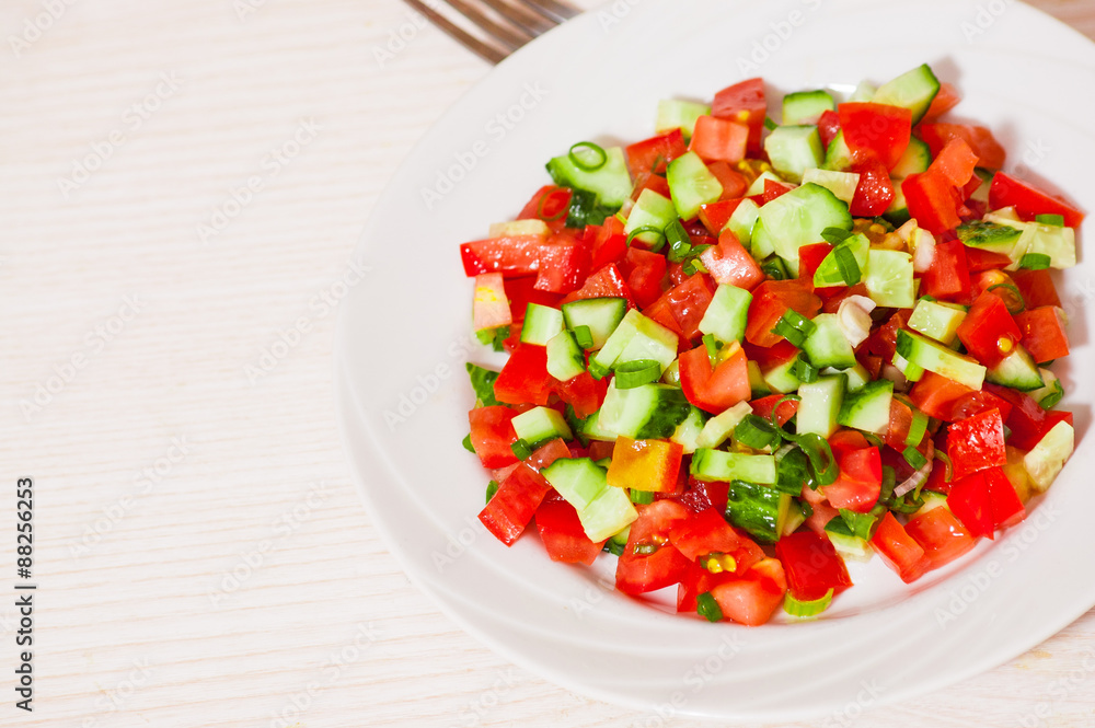 fresh vegetable salad with tomato, cucumber and green onion