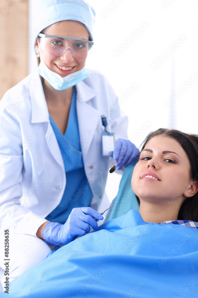 Woman dentist working at her patients teeth Woman dentist working at her patients teeth