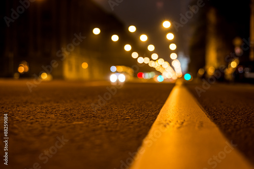 Nights lights of the big city, the night avenue with road markin photo