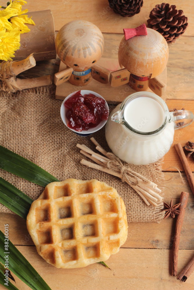 Sweet waffles and fresh milk with jam. Sweet waffles and fresh milk with jam.