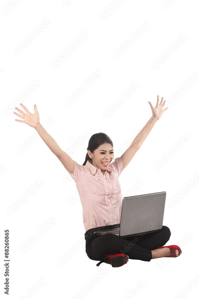 Asian business woman working on a laptop and sitting on the floor Asian business woman working on a laptop and sitting on the floor