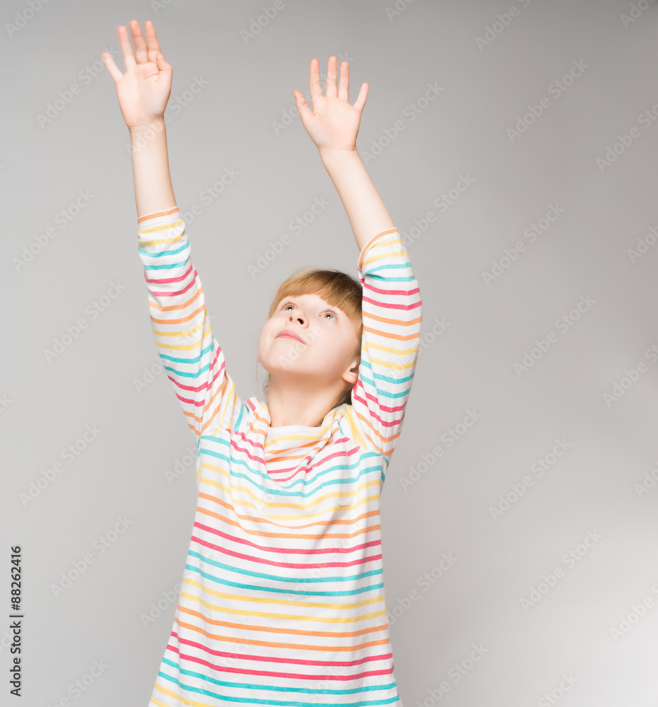 A little girl raised her hands up A little girl raised her hands up