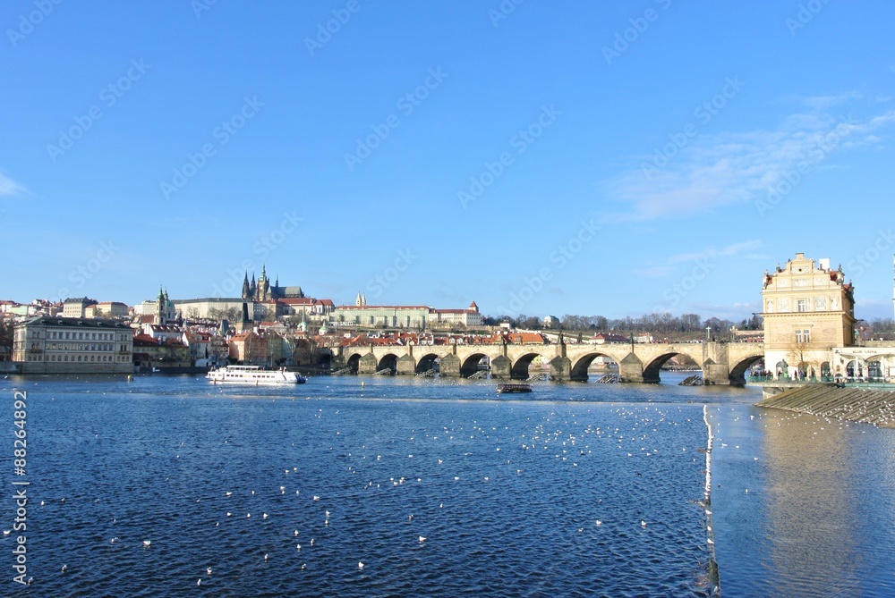View on the Charles Bridge and Prague Castle on a clear, sunny, winter day. Cityscape.