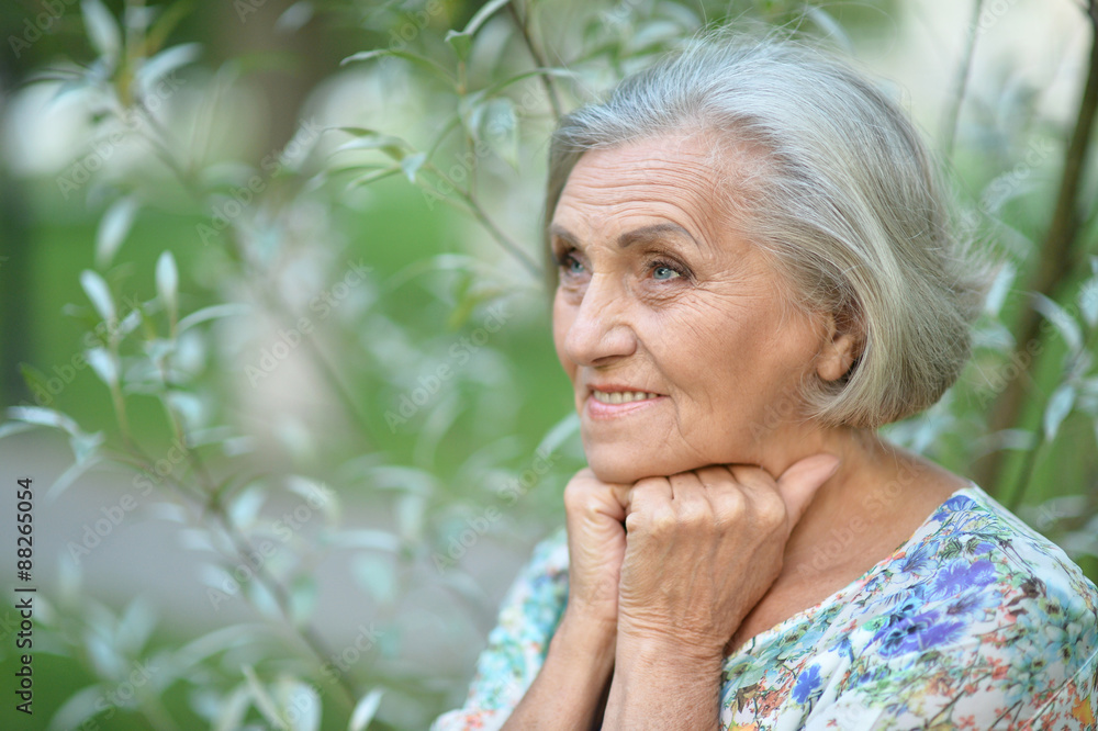 Senior woman in summer park Senior woman in summer park