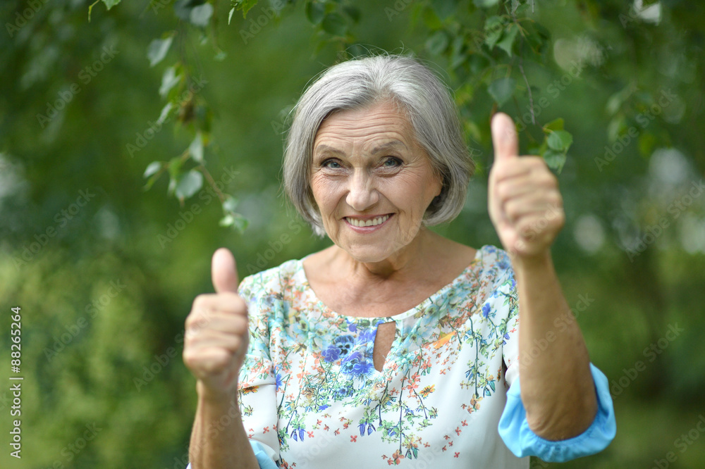 Senior woman showing thumbs up Senior woman showing thumbs up