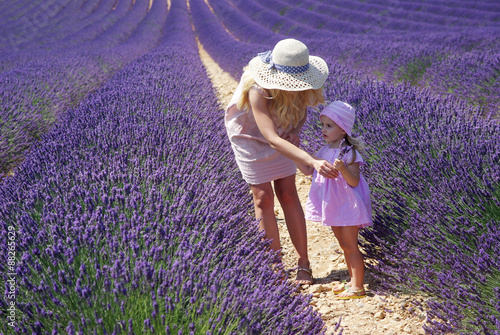 Valensole, France. Mother with daughter in lavender field