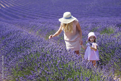 Valensole, France. Mother with daughter in lavender field