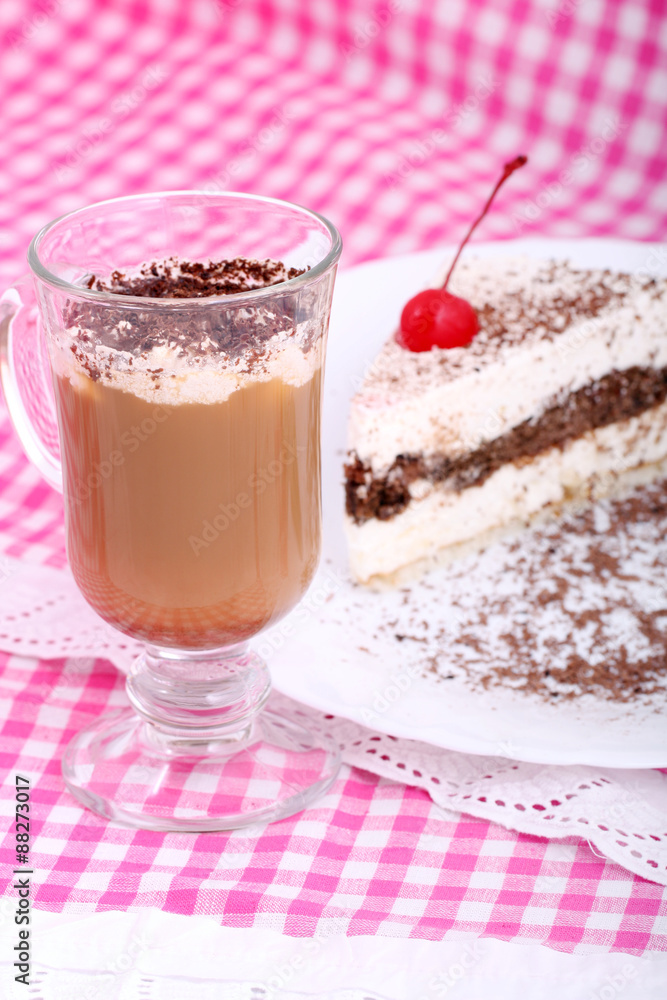 piece of chocolate cake on white plate and cappuchino on checkered table-cloth
piece of chocolate cake on white plate and cappuchino on checkered table-cloth
